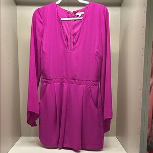 Fuchsia Grommet neckline long sleeve romper by Gianni Bini
